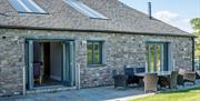 Exterior and patio seating at Low Ploughlands Holiday Lets in Little Musgrave, Cumbria