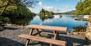 Picnic by the lake at Hill of Oaks Holiday Park in Windermere, Lake District