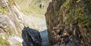 Climbers at Via Ferrata Xtreme at Honister Slate Mine in Borrowdale, Lake District