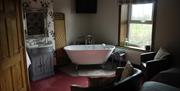 Bedroom with Standalone Bath at Midtown Farm Bed and Breakfast in Easton, Cumbria