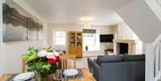 Dining area and lounge in a self catered unit at Waterfoot Park in Pooley Bridge, Lake District