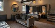 Bedroom with Seating Area at Armathwaite Hall Hotel and Spa in Bassenthwaite, Lake District