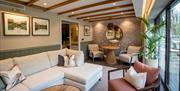 Lounge Area in a Bedroom at Armathwaite Hall Hotel and Spa in Bassenthwaite, Lake District