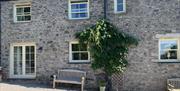 Exterior and Outdoor Seating at Autumn Cottage at Helm Mount Cottages in Barrows Green, Cumbria