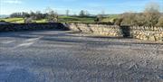 Outdoor Space and Parking Area at Autumn Cottage at Helm Mount Cottages in Barrows Green, Cumbria