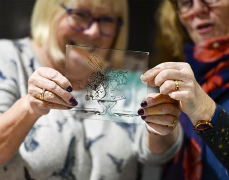 Visitors Viewing Stained Glass from the Stained & Fused Glass Thursday Events at Brewery Arts in Kendal, Cumbria