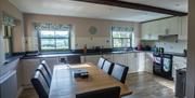 Kitchen and dining area at Low Ploughlands Holiday Lets in Little Musgrave, Cumbria