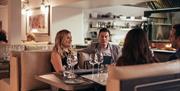 Guests Dining at Blue Smoke on the Bay Restaurant at Low Wood Bay Resort & Spa in Windermere, Lake District