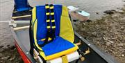 types of accessible canoe seats. brightly coloured with back and side support