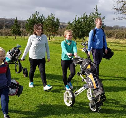 Family Golfing at Casterton Golf Course in Casterton, Cumbria