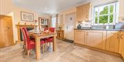 Kitchen with Dining Table at Springbank Cottage in Coniston, Lake District