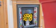 Sunflowers in Fireplace at Springbank Cottage in Coniston, Lake District