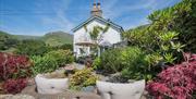 Outdoor seating and garden at Broadrayne Farm Cottages in Grasmere, Lake District