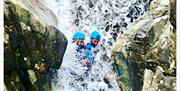 Visitors Scrambling and Canyoning with Crags Adventures in the Lake District, Cumbria