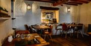 Dining Tables and Seating at The Restaurant at Crooklands Hotel in Milnthorpe, Cumbria