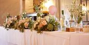 Head Table Decorations for a Wedding at Crooklands Hotel in Milnthorpe, Cumbria