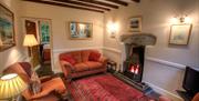 Lounge and fireplace at 3 Tarn Cottages in Grasmere, Lake District