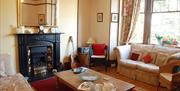 Lounge and fireplace at Denehurst Guest House in Windermere, Lake District