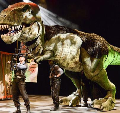 Photo of Performers of Dinosaur World Live, for a Performance at The Forum in Barrow-in-Furness, Cumbria from 13-14 June 2023
