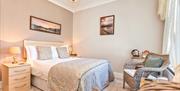 Double Bedroom with Chairs at The Glen Guest House in Oxenholme, Cumbria