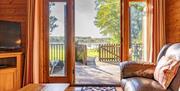 Lounge, Views, and Outdoor Access from Dunnock Lodge at The Tranquil Otter in Thurstonfield, Cumbria