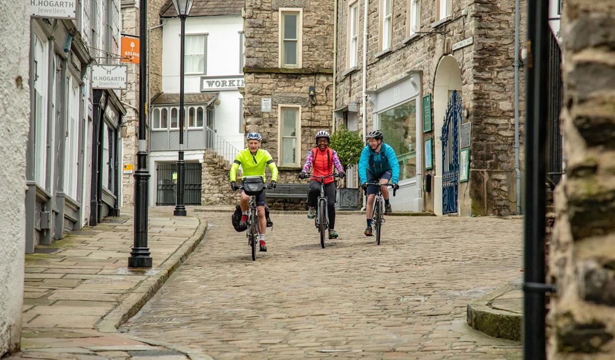 Visitors Cycling in Kendal with E-Bike Safaris Ltd in the Lake District, Cumbria