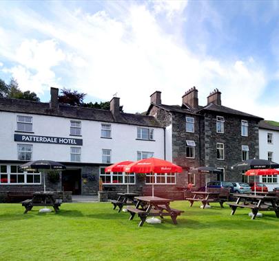 Exterior and picnic tables at The Patterdale Hotel in Ullswater, Lake District