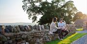 Family Sitting Outside at Eden Heights Glamping in Appleby-in-Westmorland, Cumbria