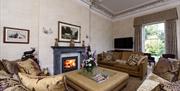 Lounge with Fireplace and Wall Mounted Television at The Fitz in Cockermouth, Lake District