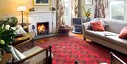 Lounge and fireplace at Rowling End in Keswick, Lake District
