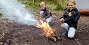 Children Learning Firestarting Skills with Green Man Survival in Newby Bridge, Lake District