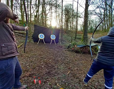 Visitors Shooting at Archery Targets with Green Man Survival in Newby Bridge, Lake District