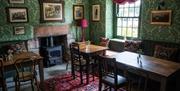 Dining Room Seating and Wood Burner at George and Dragon in Clifton, Cumbria