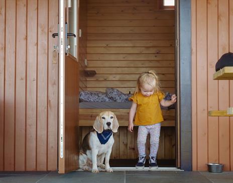 Child and Dog at Glamping Burrows at The Quiet Site Holiday Park in Ullswater, Lake District