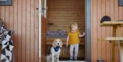 Child and Dog at Glamping Burrows at The Quiet Site Holiday Park in Ullswater, Lake District