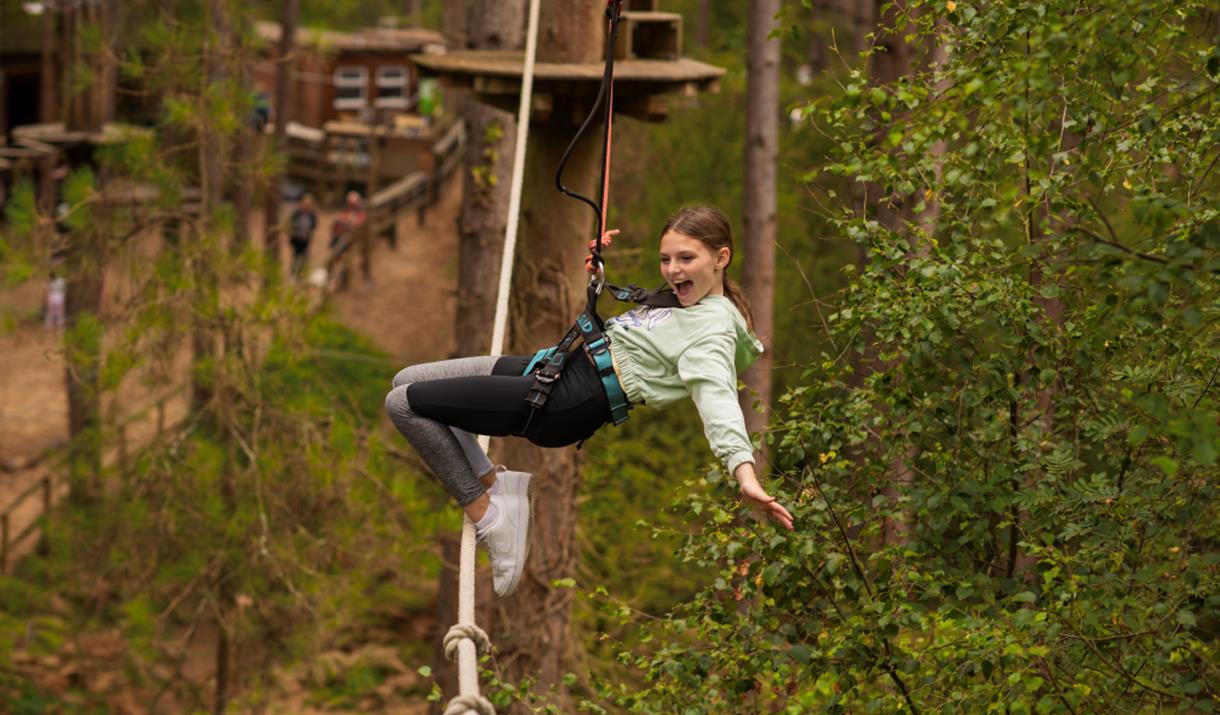 Child on a Zip Line at May Half Term at Go Ape Grizedale in the Lake District, Cumbria