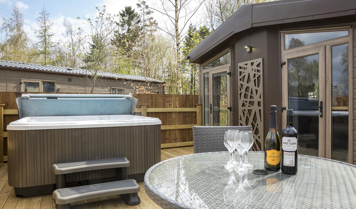 Hot Tubs with Lodges at Flusco Wood Holiday Lodges in Cumbria