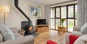 Living Space and Wood Burning Stove at Herdwick Fold at Fornside Farm Cottages in St Johns-in-the-Vale, Lake District