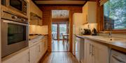 Kitchen in Heron Lodge at The Tranquil Otter in Thurstonfield, Cumbria