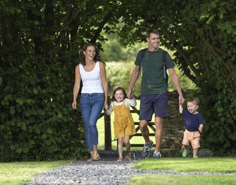 Family Walking at Hollins Farm Holiday Park in Far Arnside, Cumbria
