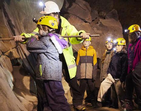 Children and a Guide on Slate Mine Tours at Honister in Borrowdale, Lake District