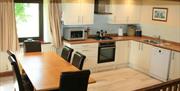 Self catering kitchen and dining area at Near Howe Cottages in Mungrisdale, Lake District