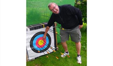 Visitor with an Archery Target with Joint Adventures in the Lake District, Cumbria