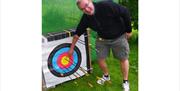 Visitor with an Archery Target with Joint Adventures in the Lake District, Cumbria