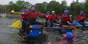 Visitors Raft Building with Joint Adventures in the Lake District, Cumbria