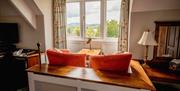 Seating with a View in a Bedroom at Lindeth Howe in Bowness-on-Windermere, Lake District