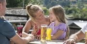 Family Enjoying Food and Drinks at Limefitt Holiday Park in Troutbeck, Lake District