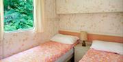 Twin beds in Retro Caravan in Manesty, Lake District