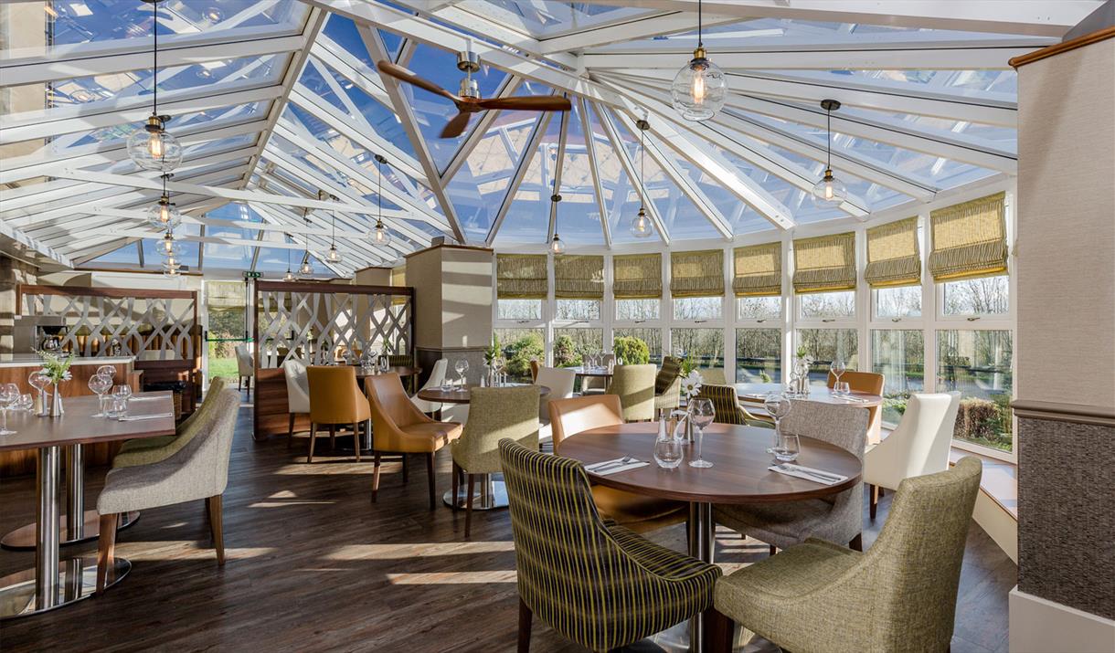 Dining Tables and Seating at The Conservatory at The Melbreak Hotel in Great Clifton, Cumbria