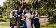 Bridal Party Posing for Photos at Muncaster Castle in Ravenglass, Lake District